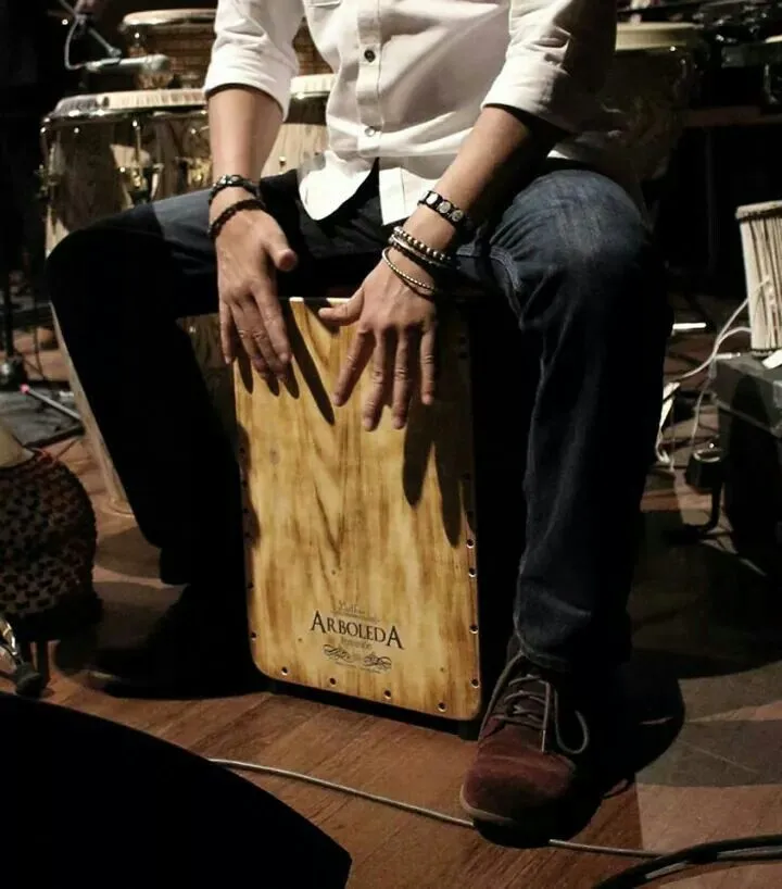 A musician playing a Peruvian cajón; an atmosphere photograph