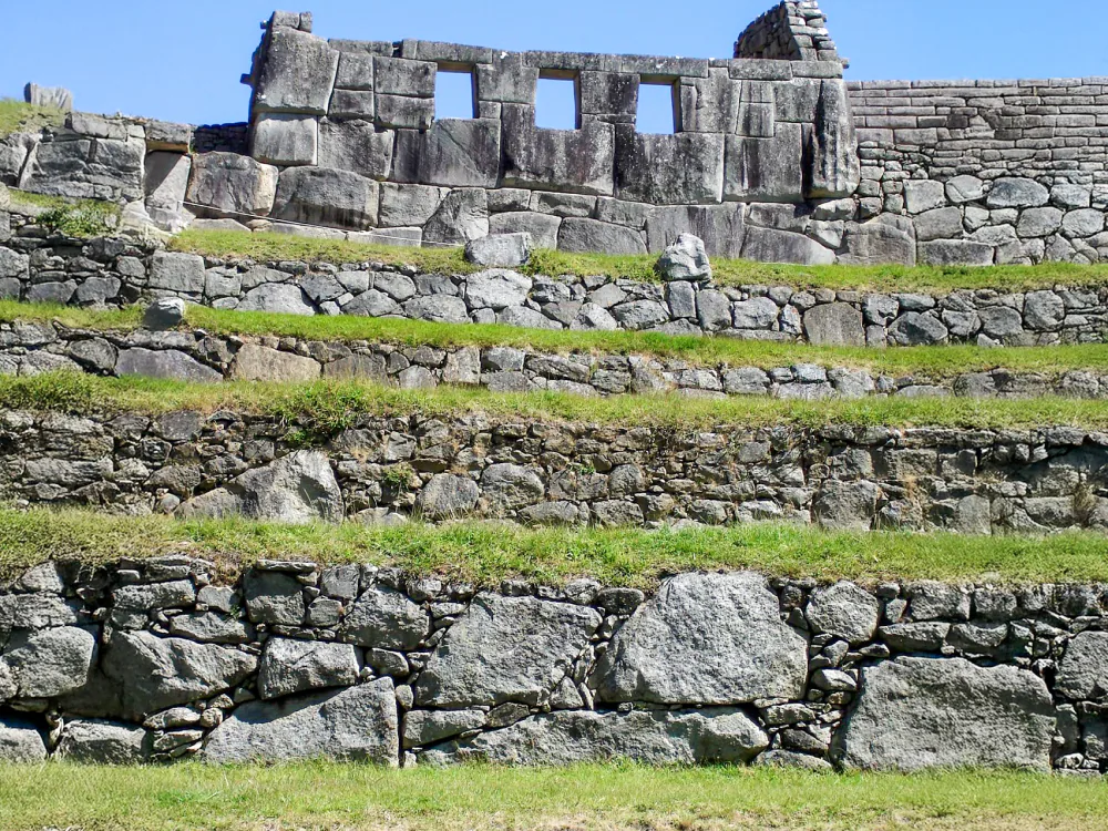 All three trapezoidal openings of the Temple of the Three Windows, with finely fitted stonework