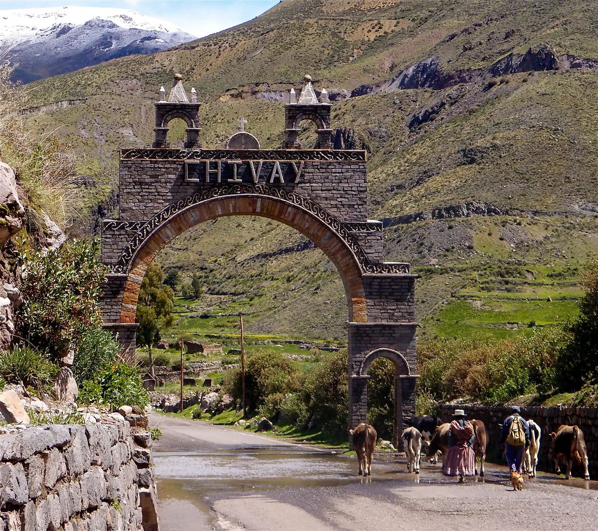 The Chivay entrance arch and a rural road scene
