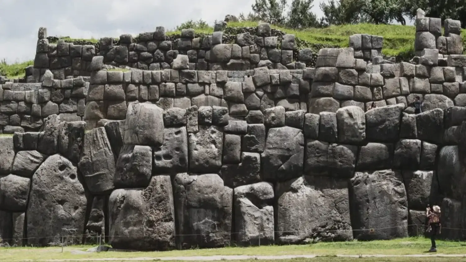 Enormous interlocking stone blocks form the terraced walls at Saqsaywaman above Cusco.