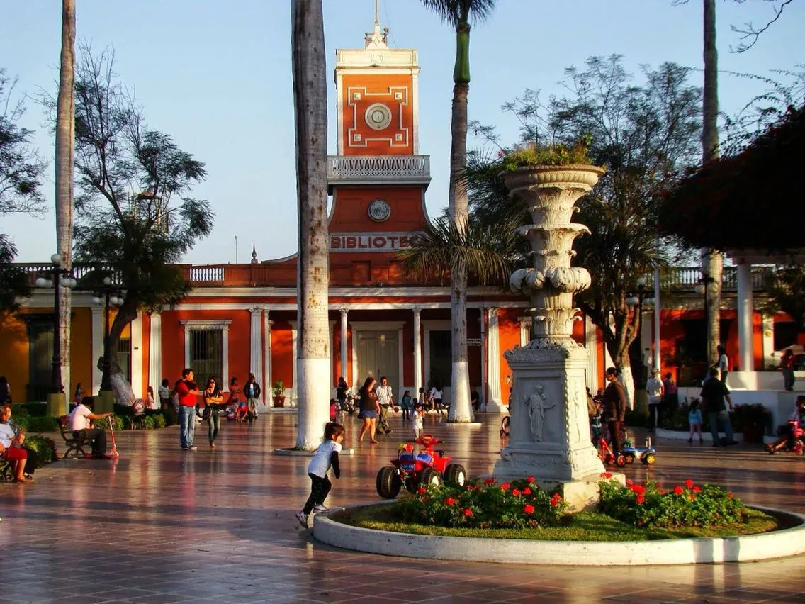 The Municipal Park fountain and red municipal library building