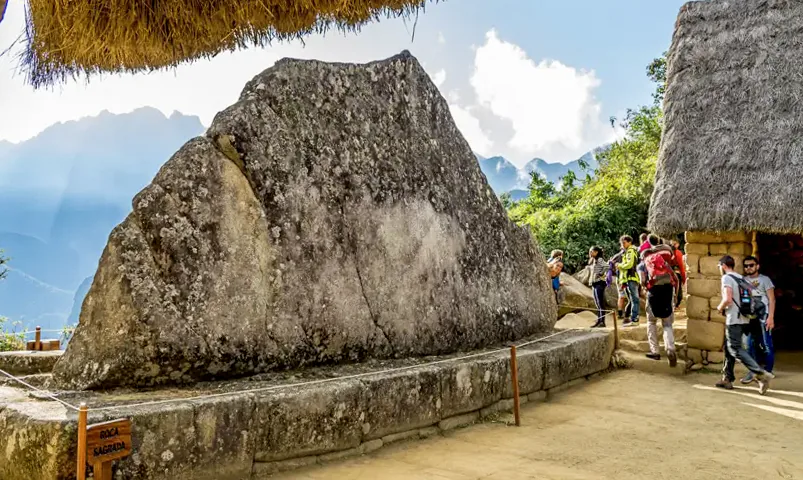 The broad mountain-shaped Sacred Rock on its stone base at Machu Picchu