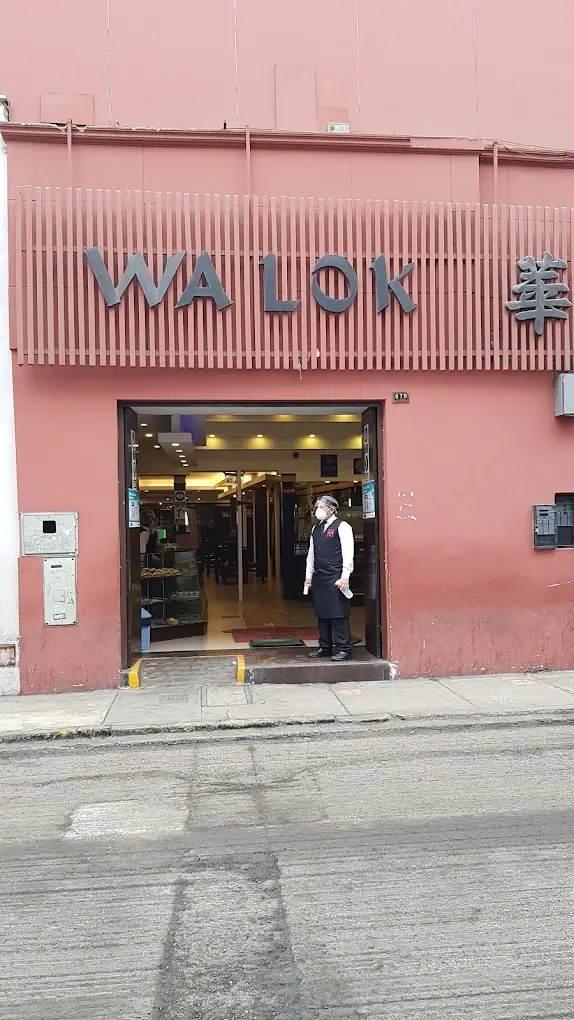 Separate inset: the signed facade of Wa Lok on Paruro