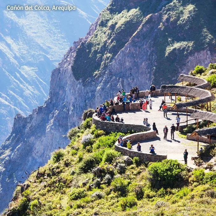 Visitors looking into the Colca Canyon from the Cruz del Cóndor viewpoint