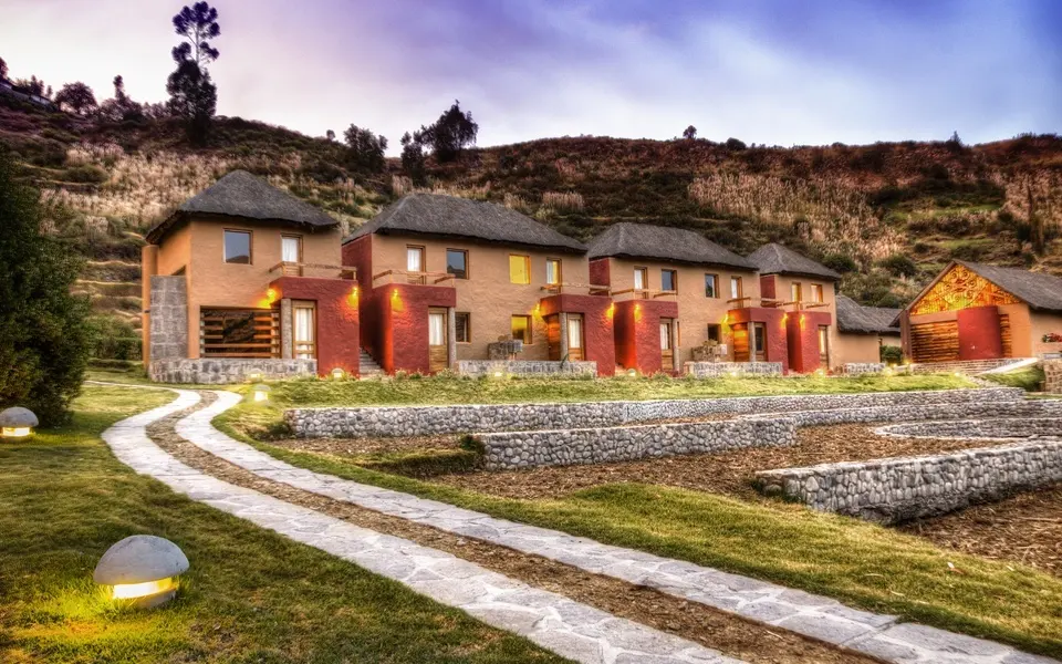 Buildings and gardens at Colca Lodge, as photographed on its official website