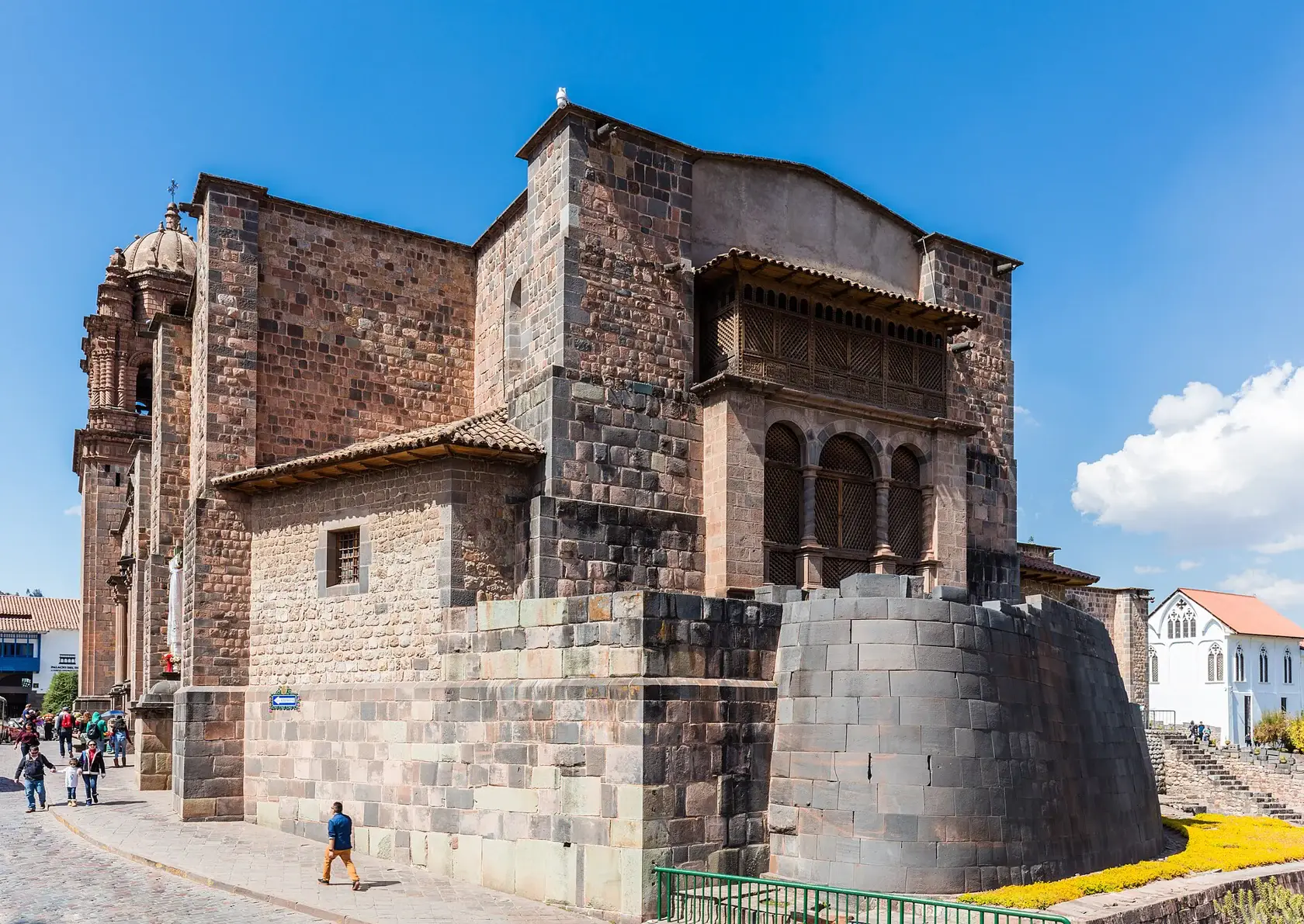 The colonial Santo Domingo complex rises above Qorikancha’s carefully fitted curved Inca stone wall.