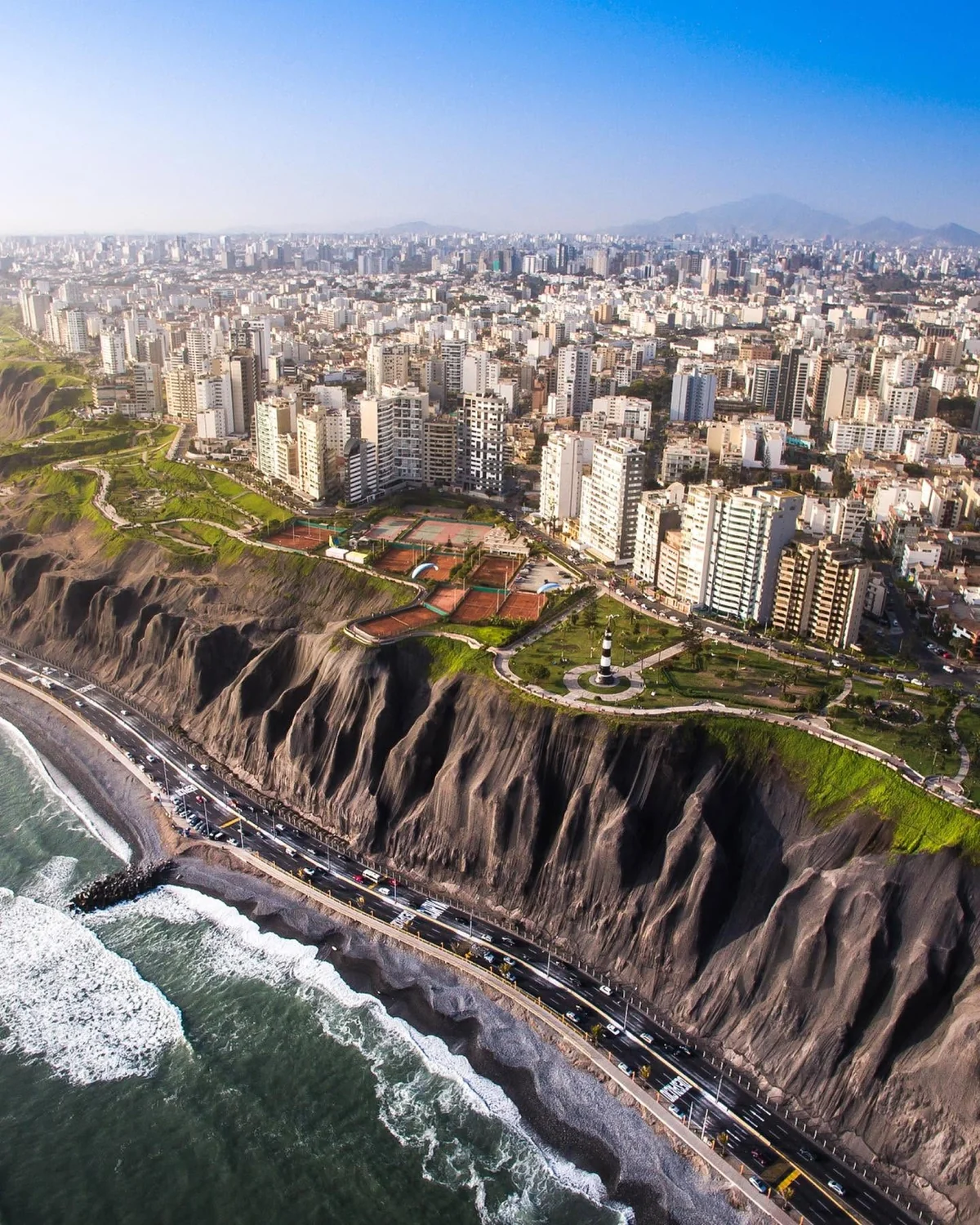 Miraflores above the Pacific, with clifftop gardens and the coastal lighthouse