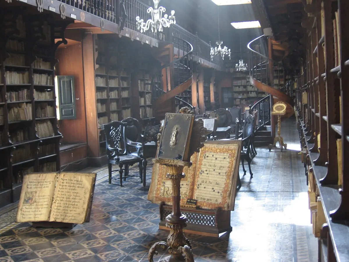 Old books, wooden shelves and a spiral stair in the San Francisco convent library.