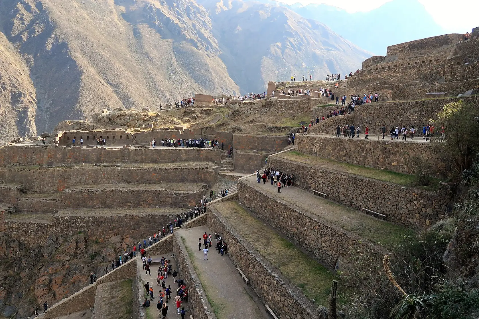 The monumental terraces and paths of Ollantaytambo on a mountainside in the Sacred Valley.